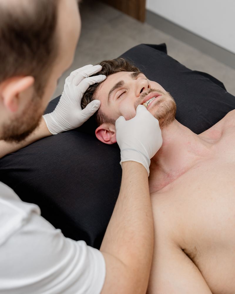 Manual assessment of the muscles of mastication during TMJ examination
